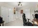 Gaming setup in this bedroom with neutral walls and carpet at 2075 Parkhaven Ct, Roswell, GA 30076
