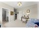 Comfortable bedroom featuring a desk, study space, and doorway to the ensuite bathroom at 2075 Parkhaven Ct, Roswell, GA 30076
