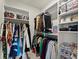 Walk-in closet with custom shelving, organized clothing racks, and plenty of storage space at 2075 Parkhaven Ct, Roswell, GA 30076