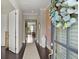 Bright and airy foyer with elegant decor and hardwood flooring at 2075 Parkhaven Ct, Roswell, GA 30076
