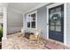 Cozy front porch featuring rocking chairs and a charming front door at 2075 Parkhaven Ct, Roswell, GA 30076