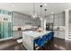 Modern kitchen boasts a marble island, stainless appliances, and sleek gray cabinetry at 2075 Parkhaven Ct, Roswell, GA 30076