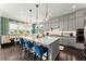 Stylish kitchen featuring a marble island, gray cabinets, and modern pendant lighting at 2075 Parkhaven Ct, Roswell, GA 30076