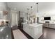 Bright kitchen featuring a large island, stainless steel appliances, and an open view to the living area at 2075 Parkhaven Ct, Roswell, GA 30076