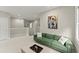 Upstairs loft-like living area with a comfortable green sofa at 2075 Parkhaven Ct, Roswell, GA 30076