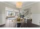 Open concept area with living, dining, and staircase, creating a modern feel at 2075 Parkhaven Ct, Roswell, GA 30076