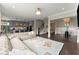 Bright living room showcasing a luxury sectional, open to kitchen, and dining areas at 2075 Parkhaven Ct, Roswell, GA 30076