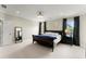 Open Primary bedroom with king bed, nightstands, and ensuite bathroom at 2075 Parkhaven Ct, Roswell, GA 30076