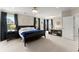 Spacious main bedroom featuring a black bed frame and dark curtains at 2075 Parkhaven Ct, Roswell, GA 30076