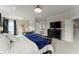 Bright main bedroom with a king bed, desk area, and en suite bathroom at 2075 Parkhaven Ct, Roswell, GA 30076