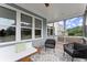 Relaxing screened-in patio featuring comfortable seating and view of the outdoors at 2075 Parkhaven Ct, Roswell, GA 30076