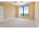 Bright bedroom with large window providing stunning green views and natural light at 3445 Stratford Ne Rd # 2703, Atlanta, GA 30326