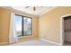 Bright bedroom featuring a large window with city views and a spacious closet at 3445 Stratford Ne Rd # 2703, Atlanta, GA 30326