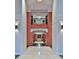 Bright, open hallway with marble floors, wooden accents, and a view of the upper level at 3445 Stratford Ne Rd # 2703, Atlanta, GA 30326