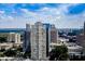 Expansive city view featuring high-rise buildings and lush green trees at 3445 Stratford Ne Rd # 2703, Atlanta, GA 30326
