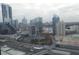 City view featuring high-rise buildings, cloudy skies, and a visible highway at 3445 Stratford Ne Rd # 2703, Atlanta, GA 30326