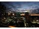 Stunning night view of the city skyline with illuminated buildings and a colorful sunset at 3445 Stratford Ne Rd # 2703, Atlanta, GA 30326