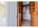Walk-in closet with custom wood shelving and drawers for optimal storage and organization at 3445 Stratford Ne Rd # 2703, Atlanta, GA 30326