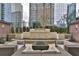 Outdoor community seating area with a fire pit and the Paramount sign feature at 3445 Stratford Ne Rd # 2703, Atlanta, GA 30326