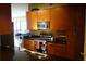 Modern kitchen featuring stainless steel appliances, wooden cabinets, and black countertops at 3445 Stratford Ne Rd # 2703, Atlanta, GA 30326