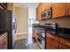 Well-equipped kitchen featuring black countertops, stainless steel appliances, and modern cabinets at 3445 Stratford Ne Rd # 2703, Atlanta, GA 30326