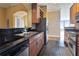 Well-designed kitchen with stainless steel appliances, dark countertops, and wooden cabinets at 3445 Stratford Ne Rd # 2703, Atlanta, GA 30326