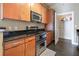 Modern kitchen with stainless steel appliances, wood cabinets, and a walk-in pantry at 3445 Stratford Ne Rd # 2703, Atlanta, GA 30326