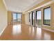 Bright living room with hardwood floors, large windows and a balcony access at 3445 Stratford Ne Rd # 2703, Atlanta, GA 30326