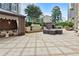 Charming outdoor lounge space with cabana seating, a water feature, and a cozy fire pit at 3445 Stratford Ne Rd # 2703, Atlanta, GA 30326