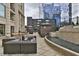 Outdoor lounge area with comfortable seating, fire pit, water feature, and city views at 3445 Stratford Ne Rd # 2703, Atlanta, GA 30326