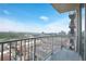 A beautiful balcony view showcasing city buildings, blue sky and forest at 361 17Th Nw St # 1702, Atlanta, GA 30363