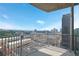 A beautiful high rise balcony view showcasing the city and distant forest at 361 17Th Nw St # 1702, Atlanta, GA 30363