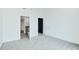 A bedroom with neutral carpet and trim leads to a bathroom and closet at 361 17Th Nw St # 1702, Atlanta, GA 30363