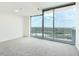A sunlit room with large sliding glass doors leading to a balcony view at 361 17Th Nw St # 1702, Atlanta, GA 30363