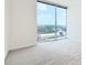 Bright room featuring neutral carpet, white walls and large glass window at 361 17Th Nw St # 1702, Atlanta, GA 30363