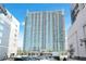 Luxury high-rise condo building featuring modern architecture and private balconies in a vibrant city location at 361 17Th Nw St # 1702, Atlanta, GA 30363