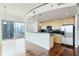 Modern kitchen boasts sleek cabinets, black countertops, and stainless steel appliances, all with a beautiful city view at 361 17Th Nw St # 1702, Atlanta, GA 30363