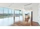 Bright, open living area features hardwood floors, floor-to-ceiling windows, and a connected modern kitchen at 361 17Th Nw St # 1702, Atlanta, GA 30363