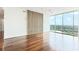 Hardwood floors, modern accent wall, and a large window offering expansive green views at 361 17Th Nw St # 1702, Atlanta, GA 30363