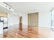 Modern open concept living space with hardwood floors, modern lighting, and large windows offering city views at 361 17Th Nw St # 1702, Atlanta, GA 30363
