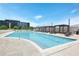 A pristine, long pool surrounded by lounge chairs and cabanas for relaxing at 361 17Th Nw St # 1702, Atlanta, GA 30363