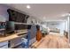 Basement home office with a custom gaming desk, multiple monitors, and a comfortable gray chair at 1885 N Creek Cir, Alpharetta, GA 30009