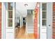 Inviting foyer with hardwood floors and an open staircase, filled with natural light at 1885 N Creek Cir, Alpharetta, GA 30009