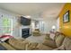 Cozy living room with a fireplace and large comfortable sofa, great for relaxing or entertaining at 1885 N Creek Cir, Alpharetta, GA 30009