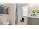Bathroom with stylish tile flooring, modern fixtures, and a shower-tub combination at 3076 Yellowhammer Dr, Marietta, GA 30064