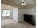 Bedroom with white tray ceiling and large bay window and dark entertainment center at 3381 Walkers Ridge Rd, Dacula, GA 30019