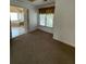Bedroom with tan carpet, bay window and doorway into the primary bathroom at 3381 Walkers Ridge Rd, Dacula, GA 30019