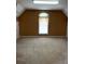 An open bonus room with neutral walls, carpet, and a large window at 3381 Walkers Ridge Rd, Dacula, GA 30019