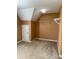 A carpeted walk-in closet with built-in shelving and a neutral color palette at 3381 Walkers Ridge Rd, Dacula, GA 30019