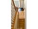 View of the front door and entryway from the top of the staircase, showcasing the slate tile flooring at 3381 Walkers Ridge Rd, Dacula, GA 30019